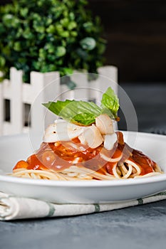 Delicious pan seared bay scallop and squid marinara pasta