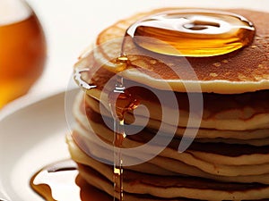 Delicious pancakes on plate with maple syrup