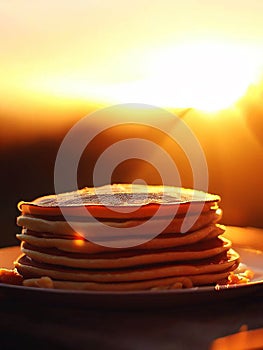 Delicious pancakes on plate with maple syrup