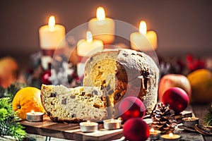 Delicious panettone on christmas table wit decorations and advent wreath and candles