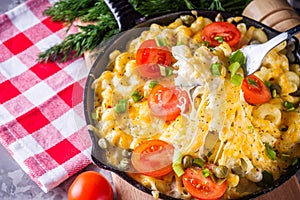 Delicious pasta and cheese casserole in a cast iron skillet