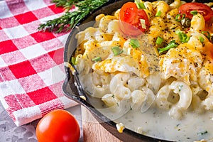 Delicious pasta and cheese casserole in a cast iron skillet