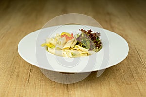 Delicious pasta on plate on wooden table