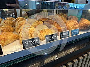 Delicious pastry with different filling inside a showcase