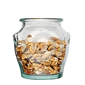 Delicious peeled walnuts in a glass jar isolated on white background. Nuts are a source of vegetable protein. File contains