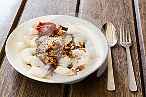 Delicious Penang Chee Cheong Fun with sauces, sesame, fried shallot. photo