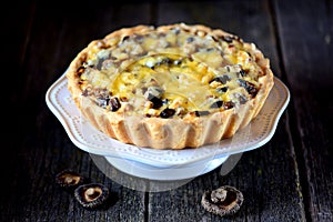 Delicious pie with chicken meat, eggplant, mushrooms, onion and cheese.