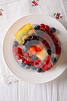 delicious piece of fruit cake jelly close-up on a plate. vertical top view