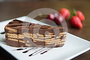 delicious piece of homemade chocolate cake with cookies