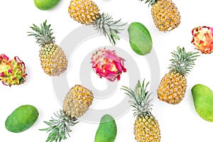 Delicious pineapple, mango and dragon fruits on white background. Flat lay, top view