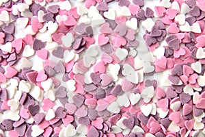 Delicious pink ValentineÂ´s Day sugar hearts and ornaments in pink, purple and white show I love you to your beloved girlfriend