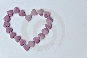 Delicious pink ValentineÃÂ´s Day sugar hearts and ornaments in pink, purple and white show I love you to your beloved girlfriend