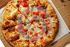 Delicious Pizza, close up photo of a delicious pizza with mozzarella cheese, onions, meat, tomato