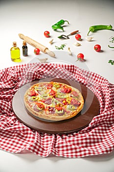 Delicious Pizza with Green Pepper, Salami and Tomatoes