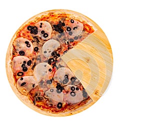 Delicious pizza with ham, mozzarella, mushrooms and olives, without a quarter on a round wooden platter, isolated on white