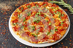 Delicious pizza with spanish sausage and cilantro