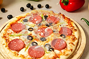 Delicious Pizza on Wooden Plate