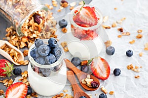 Delicious plain yogurt with fresh blueberry and strawberry in a