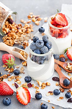 Delicious plain yogurt with fresh blueberry and strawberry in a