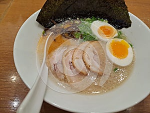 Delicious pork ramen  with egg pork broth and seaweed