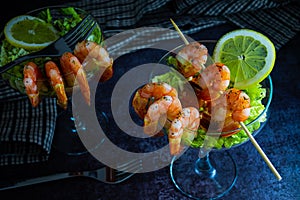 Delicious Prawn cocktail starter served in a tropical tourist restaurant in a glass with decoration of prawn with sprinkle of dill