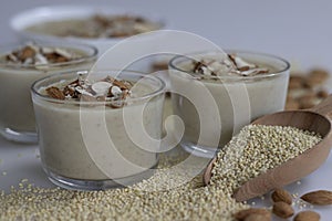 Delicious Proso Millet Kheer in a glass bowl, adorned with crunchy almonds, showcasing a nutritious dessert