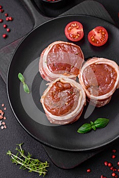 Delicious raw fresh pork or chicken meat rolls wrapped in bacon