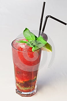 A delicious red cocktail with mint