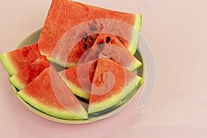 Delicious red sliced watermelon on a plate. Stock of fiber and fructose. Summer food concept