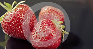 Delicious red strawberries on dark background,seasonal local fresh, for packshot