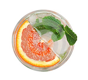 Delicious refreshing drink with sicilian orange, fresh mint and ice cubes in glass isolated on white, top view
