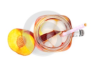 Delicious refreshing peach cocktail in mason jar on white background