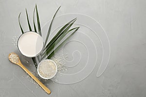 Delicious rice milk and grains on light grey table, flat lay. Space for text