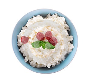 Delicious rice pudding with raspberry in bowl on white background