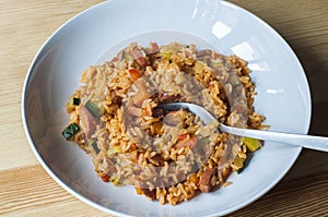 Delicious rice with stewed vegetables and sausages