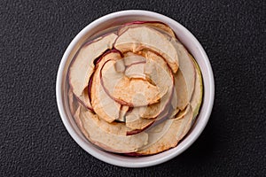 Delicious ripe red apple, sliced and dried in a special dryer