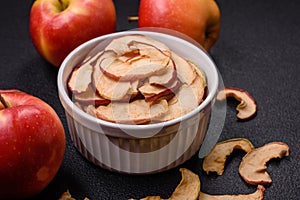 Delicious ripe red apple, sliced and dried in a special dryer