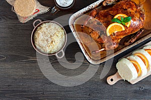 Delicious roasted duck with oranges in a pan, rustic style