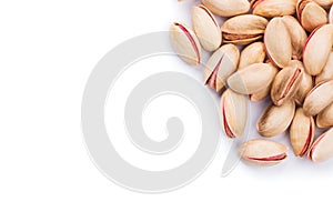 Delicious roasted pistachios on a white background photo