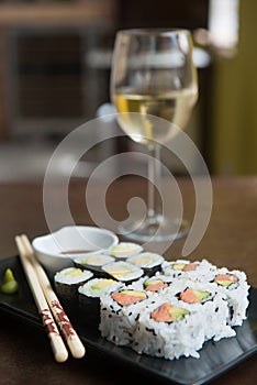 delicious rolls of rice with fish or makis, with their oriental chopsticks photo