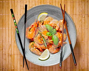 Delicious rose crevettes with chopsticks photo