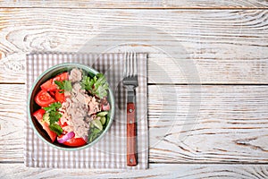 Delicious salad with canned tuna in bowl