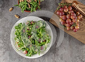 Delicious salad made from caramelized roasted grapes, peppery arugula, toasted walnuts, and pecorino cheese.