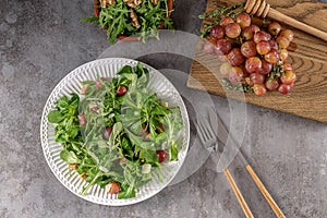 Delicious salad made from caramelized roasted grapes, peppery arugula, toasted walnuts, and pecorino cheese.