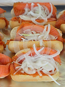 Delicious sandwich with fresh salmon and onion