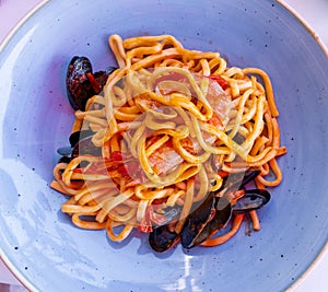 Delicious seafood big spaghetti with fresh tomato. Traditional Italian food