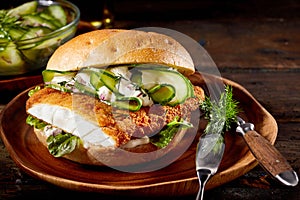 Delicious seafood burger with crumbed fish fillet photo
