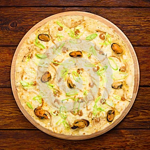 Delicious seafood pizza with olives