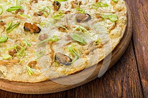 Delicious seafood pizza with olives