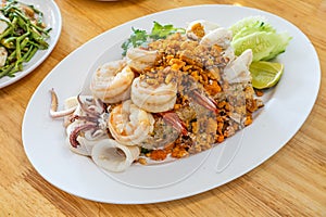 Delicious seafood thai fried rice (crab meat, shrimp, crab roe and squid